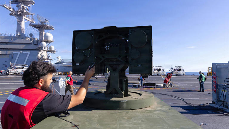 US Navy tests laser weapon that shoots down drones on the USS George HW ...