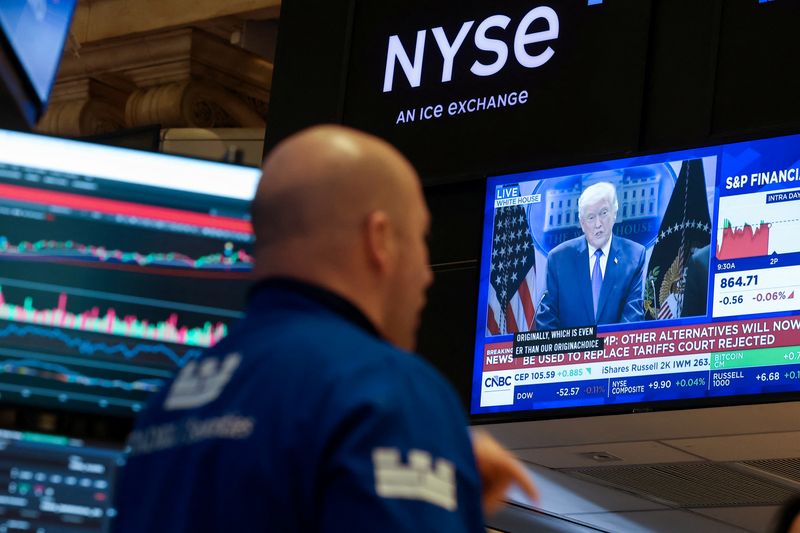 Traders react to Supreme Court's ruling on tariffs, on the floor of the NYSE in New York