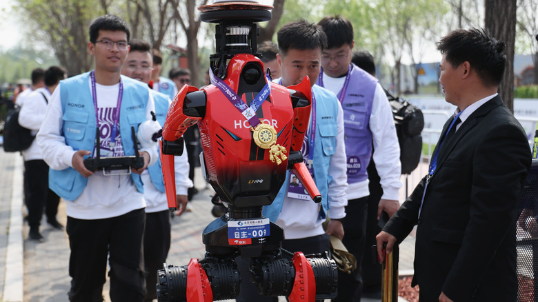 A humanoid robot raced in the Beijing half marathon and did more than ...