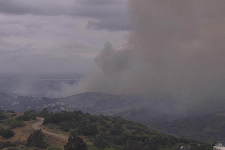 Wind fuels brush fire in OC, closing roads and forcing evacuation warnings