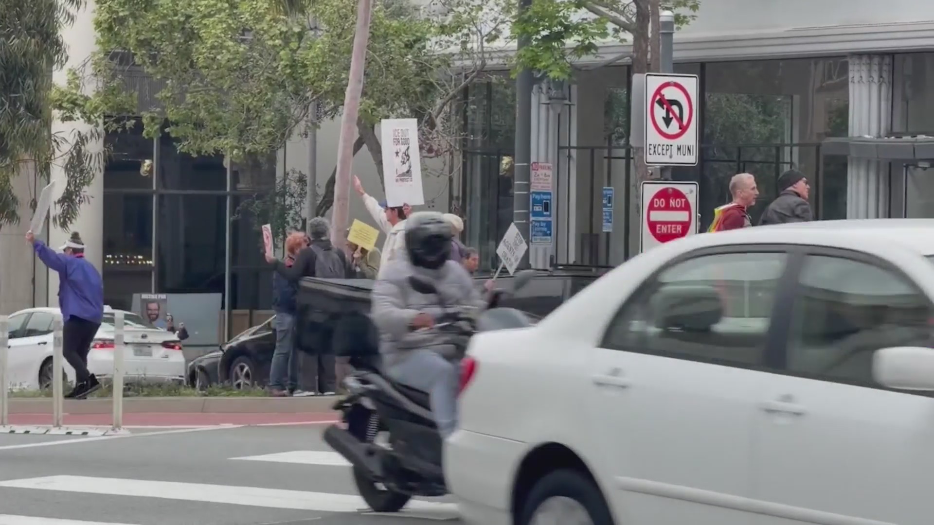 Protesters rally outside SF Tesla dealership against immigration ...