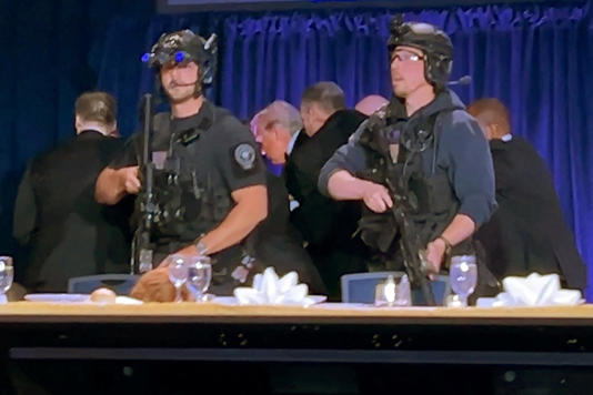 ?Shortly after the event started, shots rang out and President Donald Trump was rushed from the stage. First lady Melania Trump and other Cabinet members were present for the event (Reuters)