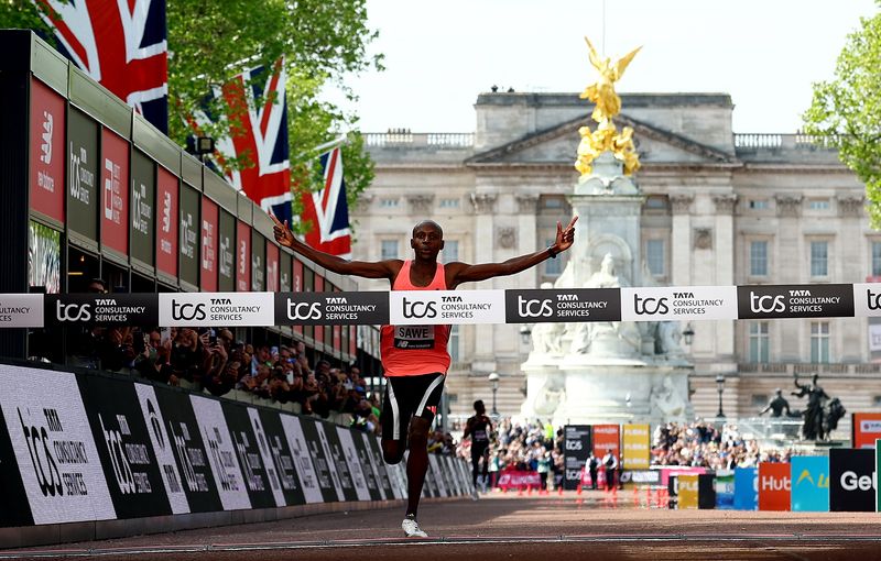 Marathon-Kenya's Sawe becomes first man to run marathon under two hours ...