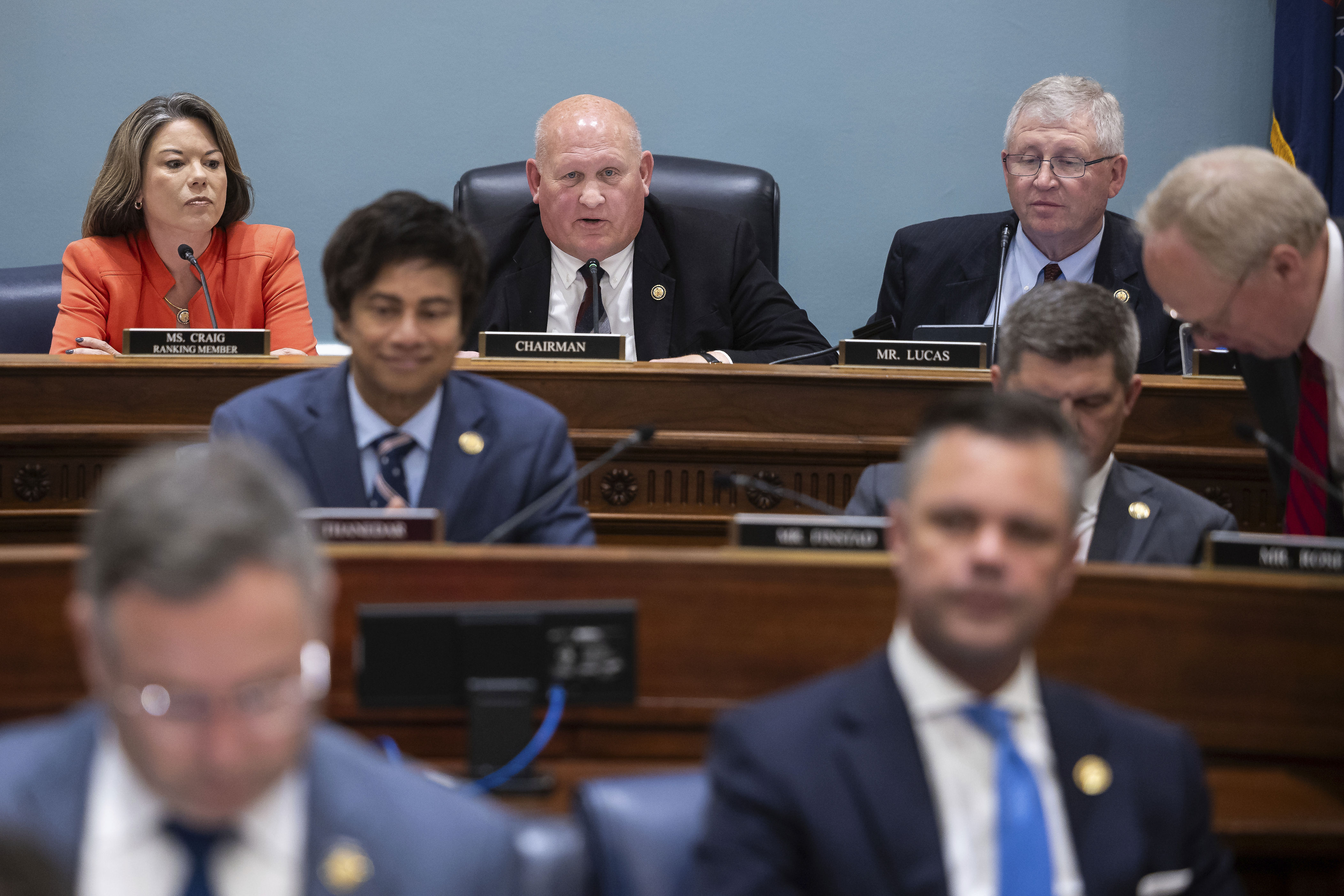 At top left, House Agriculture Committee ranking member Angie Craig and Chair G.T. Thompson are seen with other committee members during a markup on Capitol Hill on May 13, 2025.