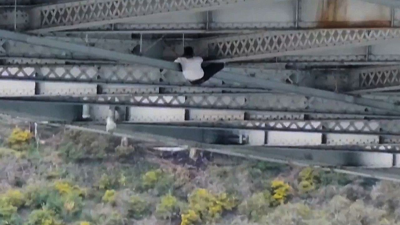 Wild San Francisco chase ends with car thief hanging under Bay Bridge