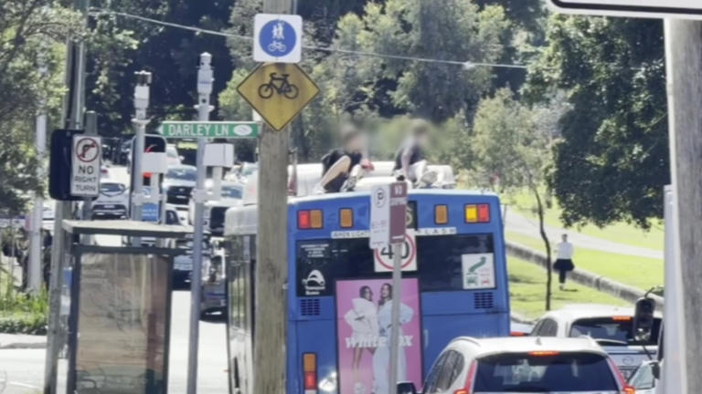 Police are seeking two boys who rode on the roof of a bus through eastern Sydney on Sunday, April 26.