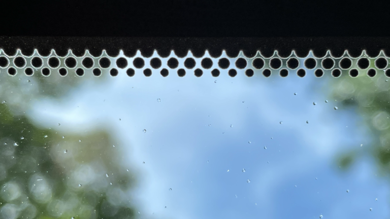 Why you should check those black dots around your windshield
