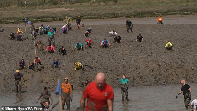 Participants ran, walked and crawled as they clambered through the thick mud and across the riverbed&nbsp;
