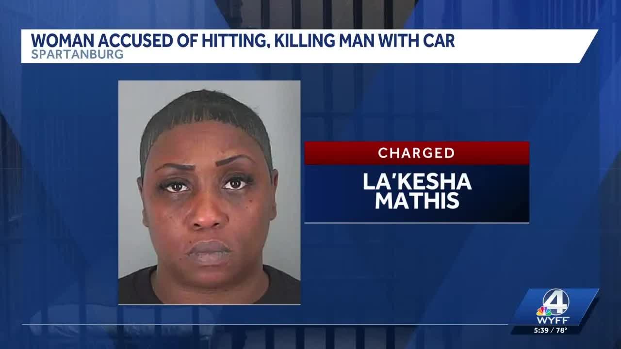 Woman accused of hitting, killing man with car, police say
