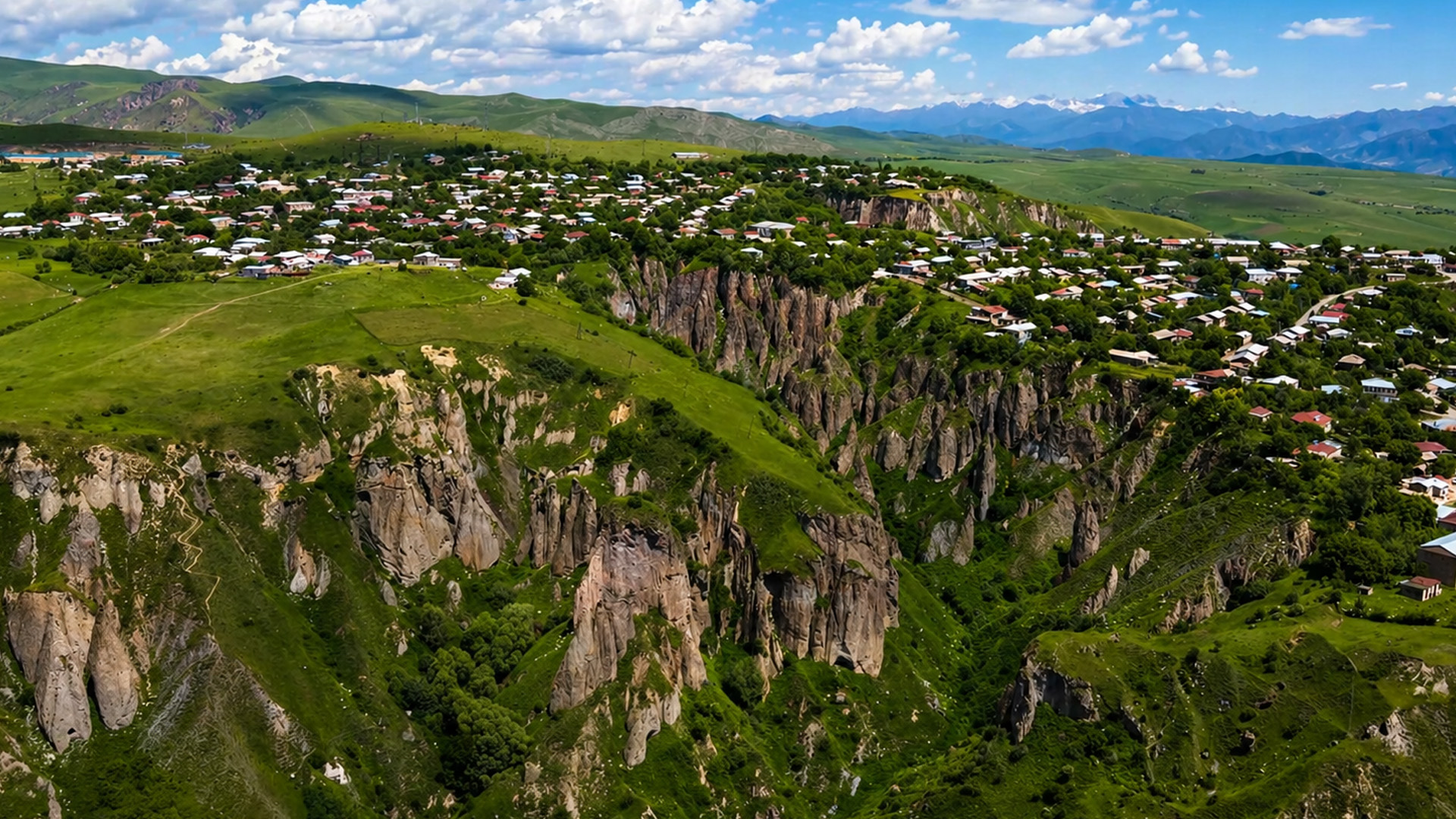 Village on the edge of giant cliffs