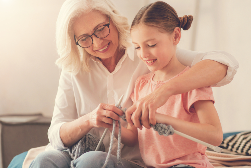 senior woman with child, knitting, hobbies for brain health