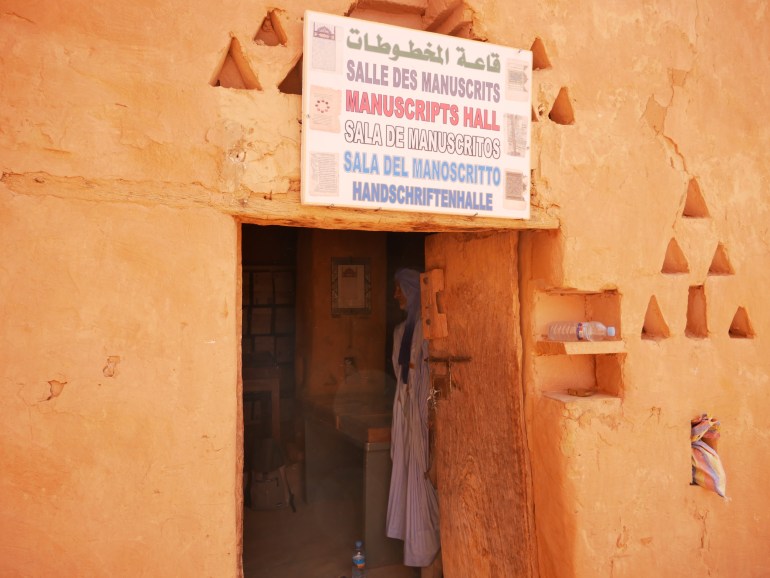 El Habot stands inside the library