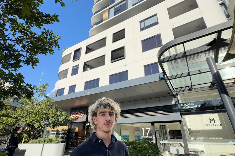 Jake Dobrin watched as the family’s Jack Russell, Elbie, was rescued from a ledge outside their apartment in Dee Why.