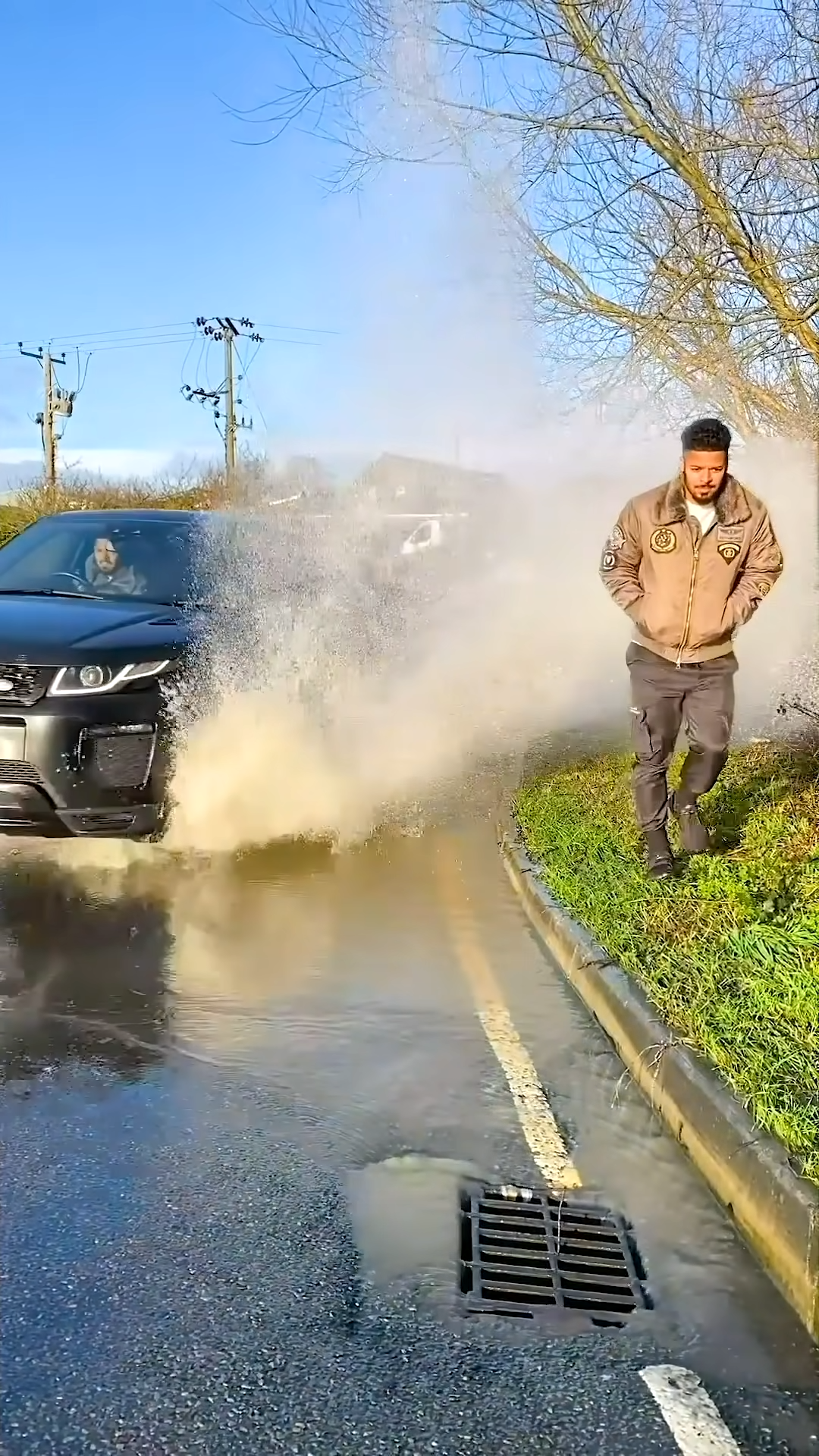 Guy gets splashed by bad driver