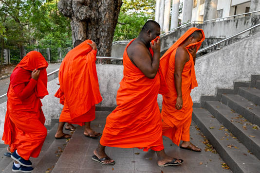 Sri Lankan monks arrive to appear before a court after their arrest in Negombo on 26 April 2026 (AFP/Getty)