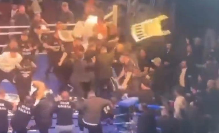World boxing title fight gets called off after chaotic brawl breaks out ...