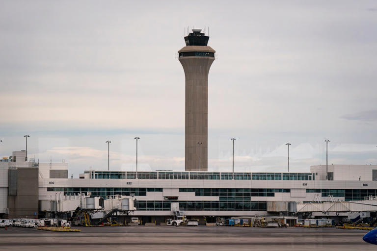 Denver airport issues ground stop over bad weather
