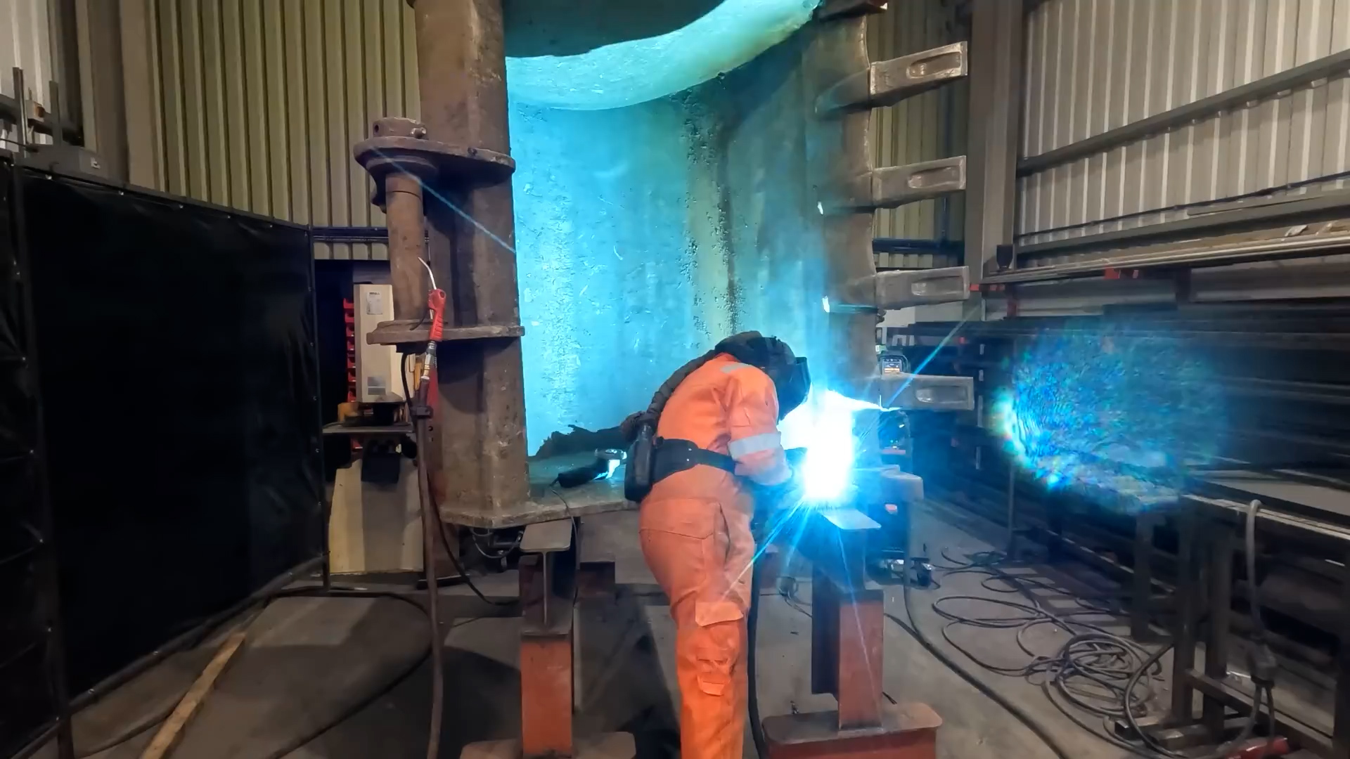 Precision welding inside heavy equipment bucket structure