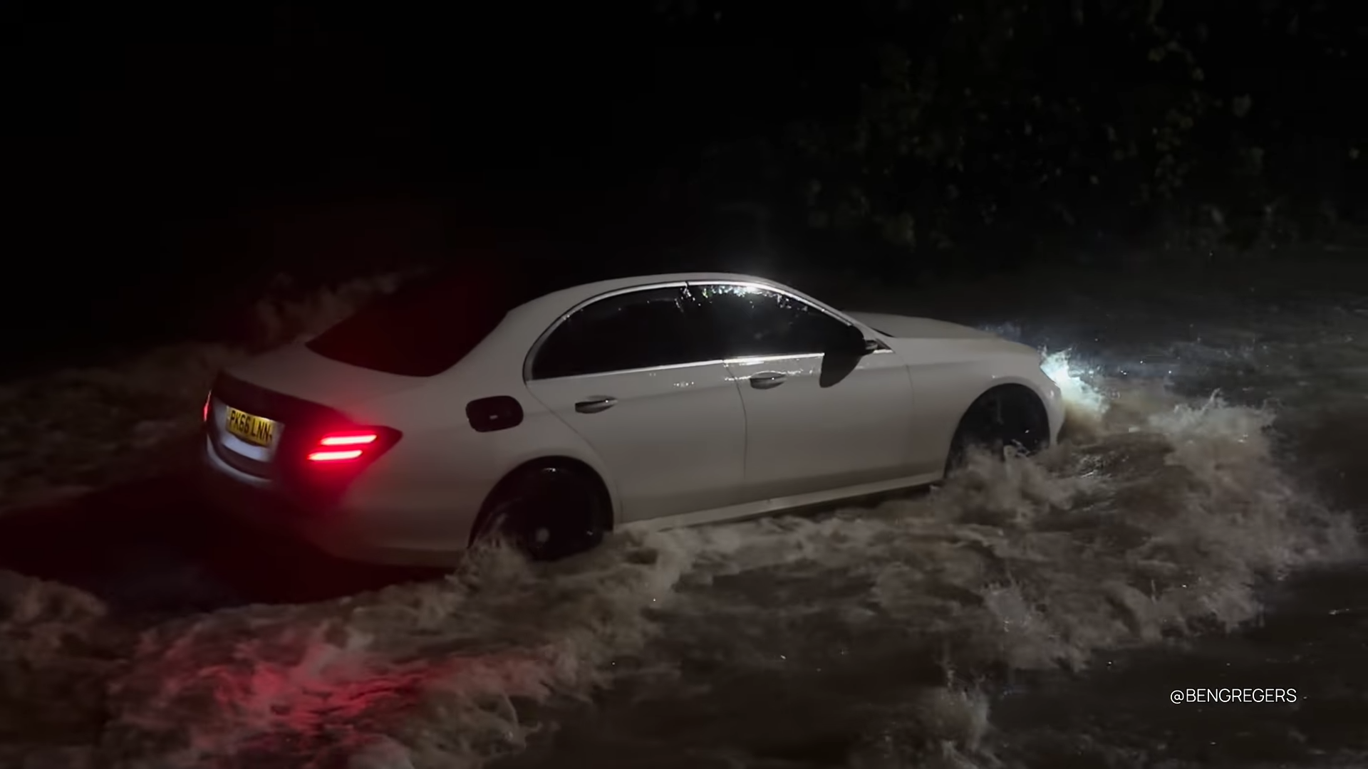 He clearly has money to waste - watch how this expensive car hits the flood