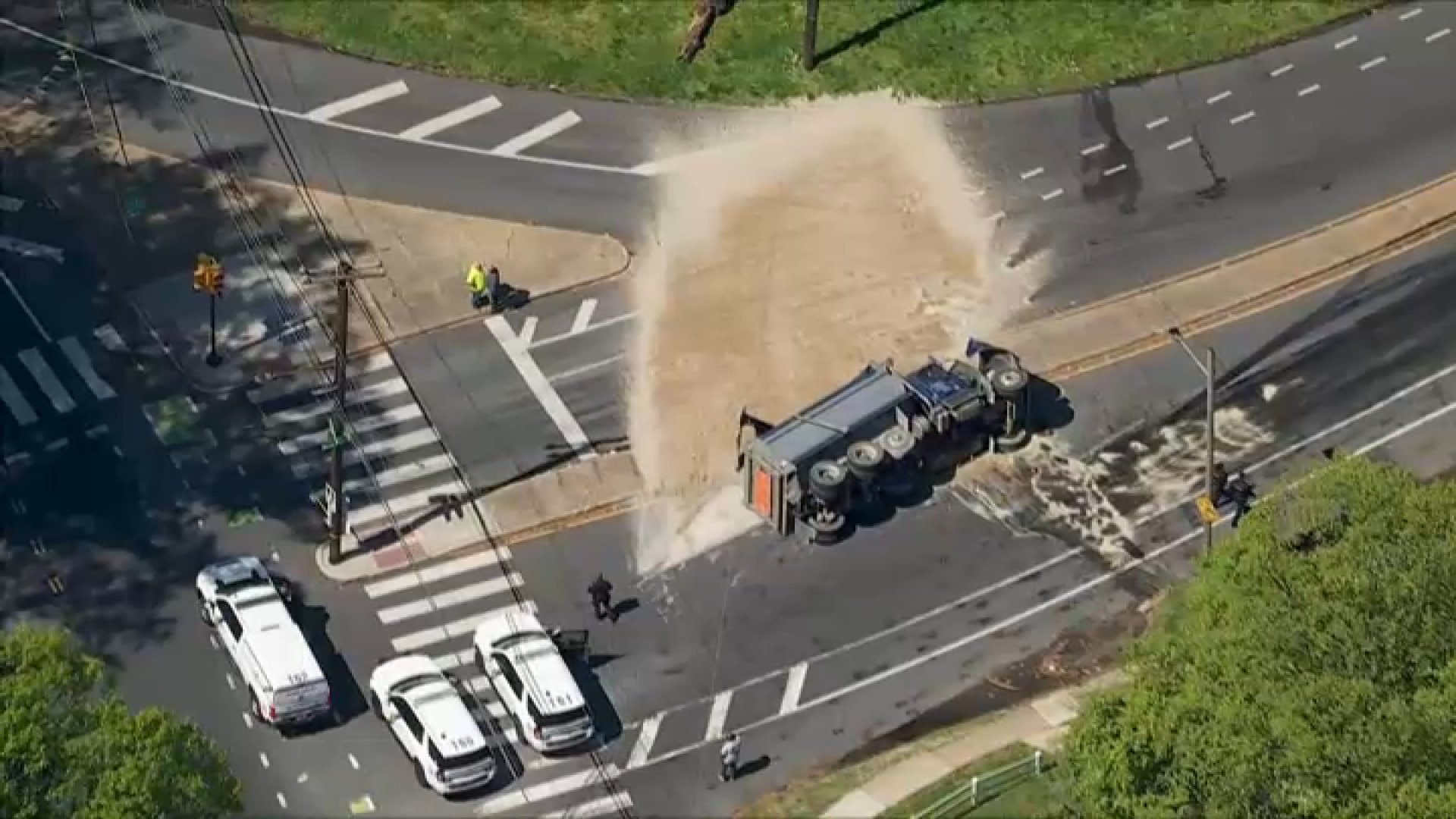 Dump truck overturns on Philadelphia road, leaving debris everywhere