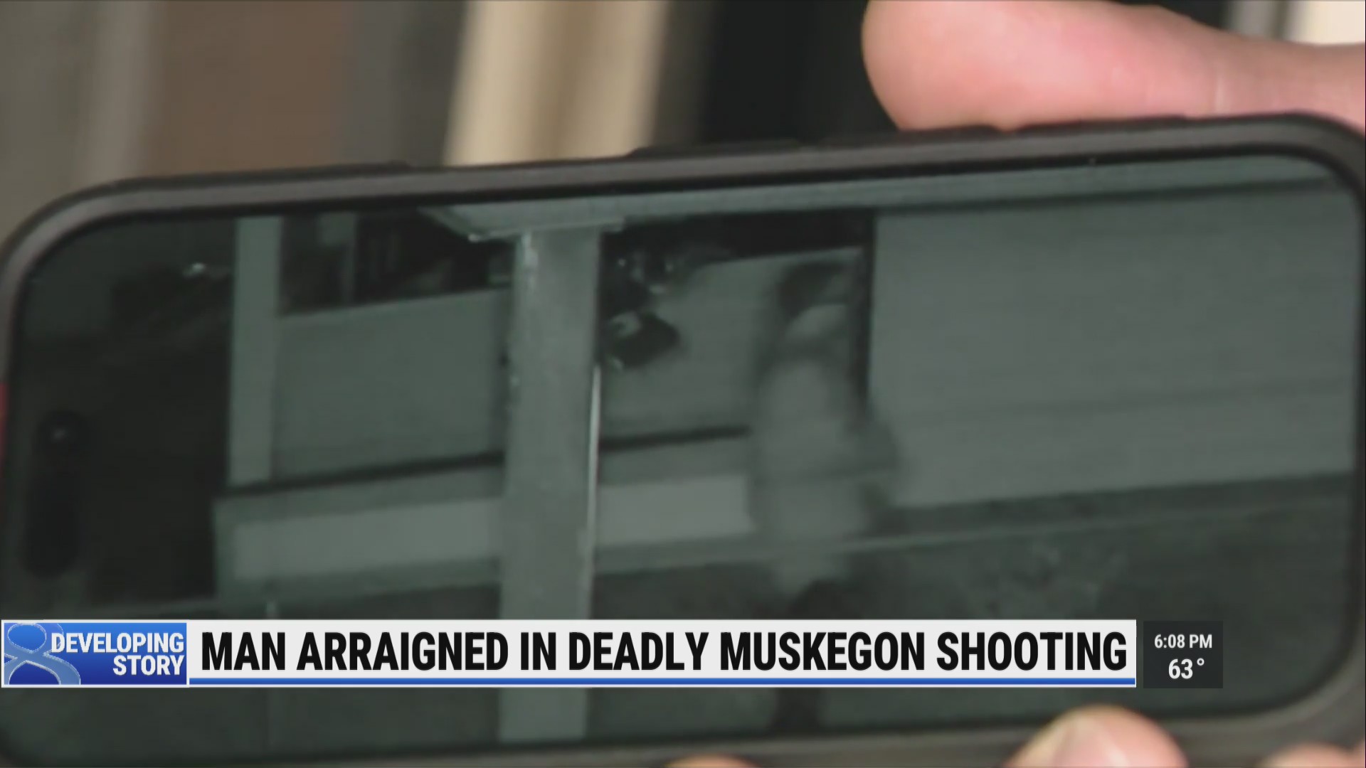 Surveillance cameras capture accused killer leaving Muskegon home