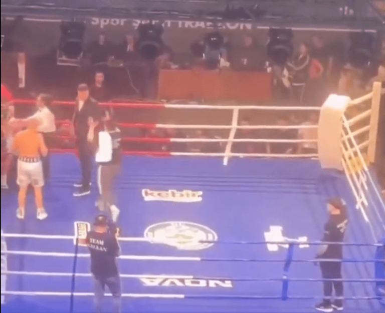 Boxer attacked by fans with chairs in chaotic scene after winning fight