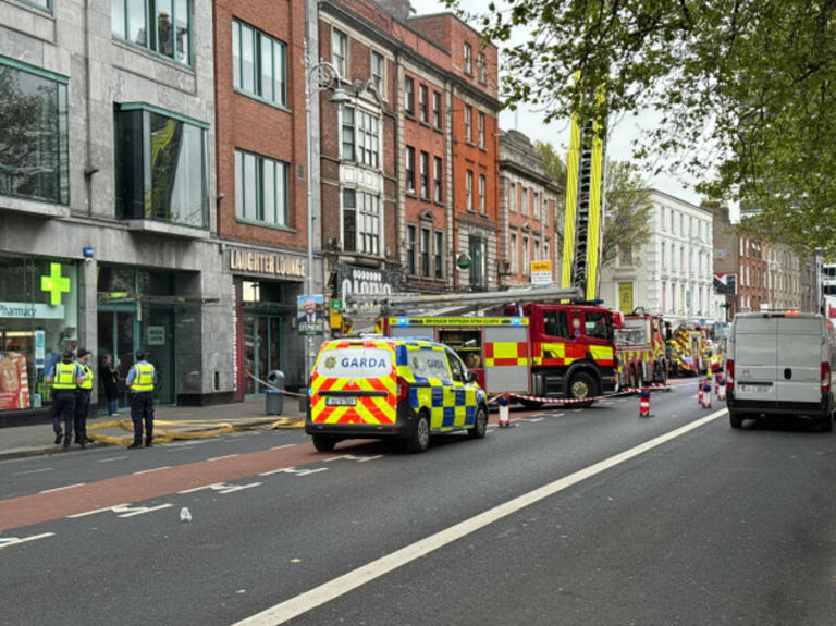 Two hospitalised and Luas services delayed after fire in Dublin city centre