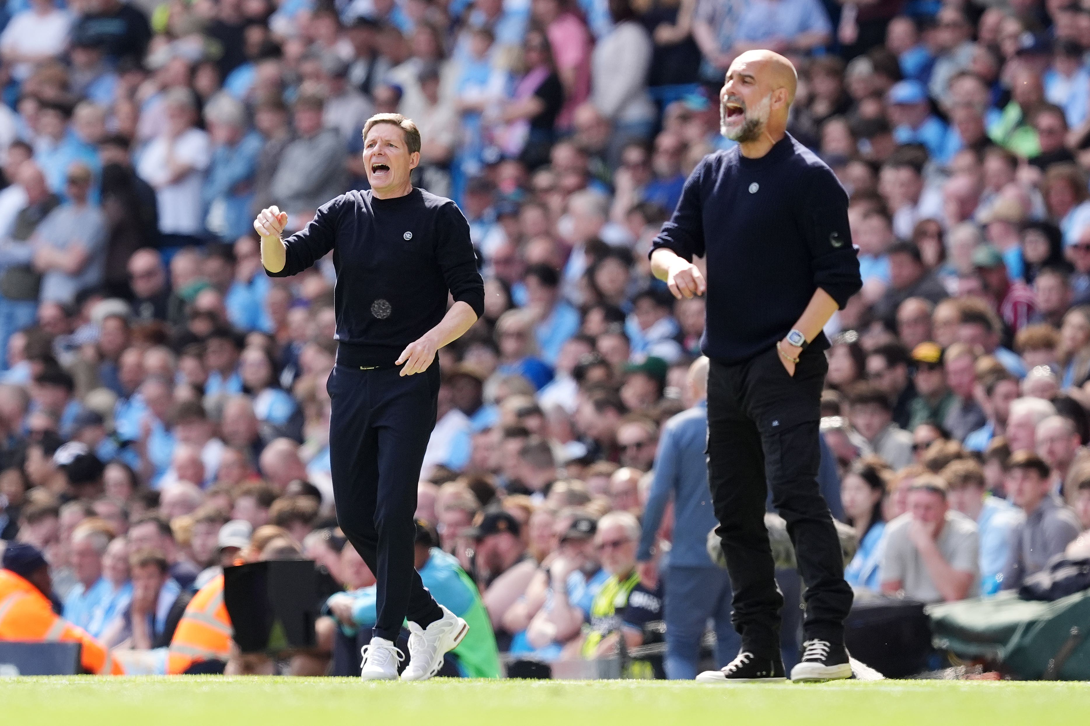 Tension in title race as Man City and Arsenal await rearranged games