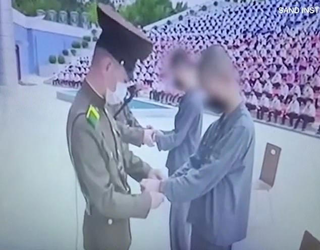 Pictured: A video from inside North Korea shows two teenagers being publicly sentenced to 12 years of hard labor for watching Korean TV dramas