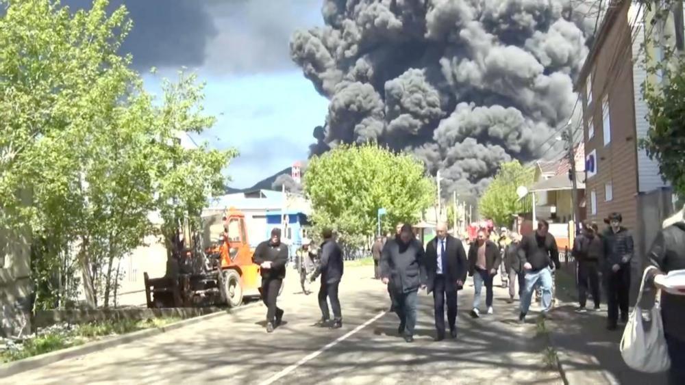 Smoke rises following a Ukrainian drone attack on an oil refinery in Tuapse, southern Russia