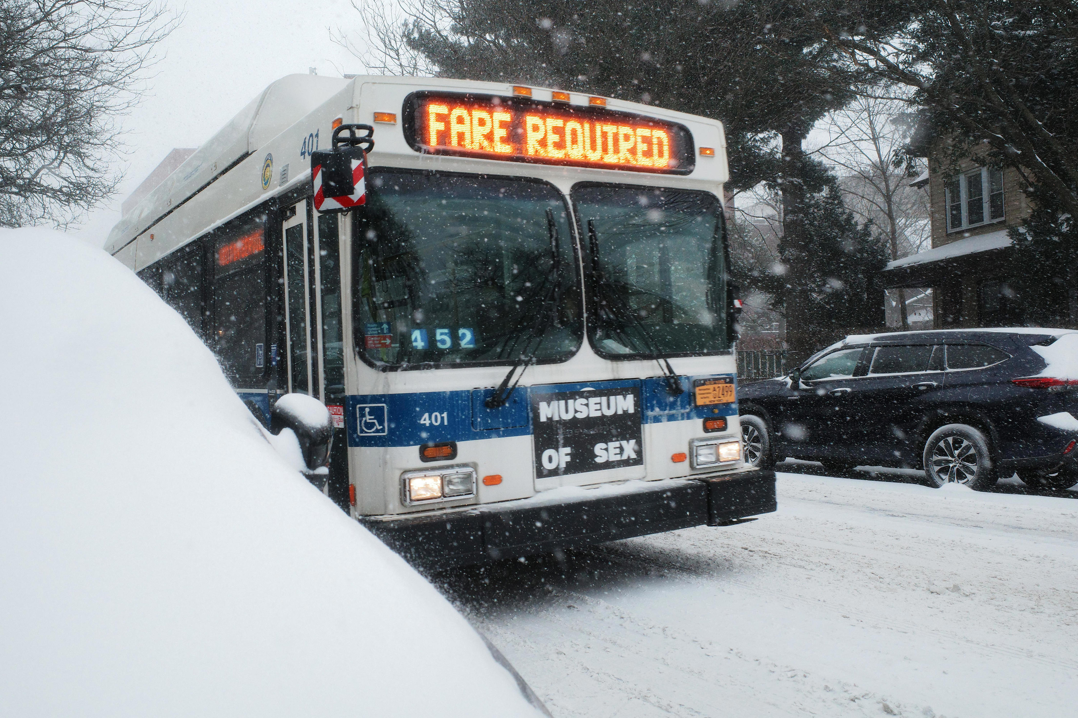 MTA staff boarding NYC buses, checking for proof of fare payment