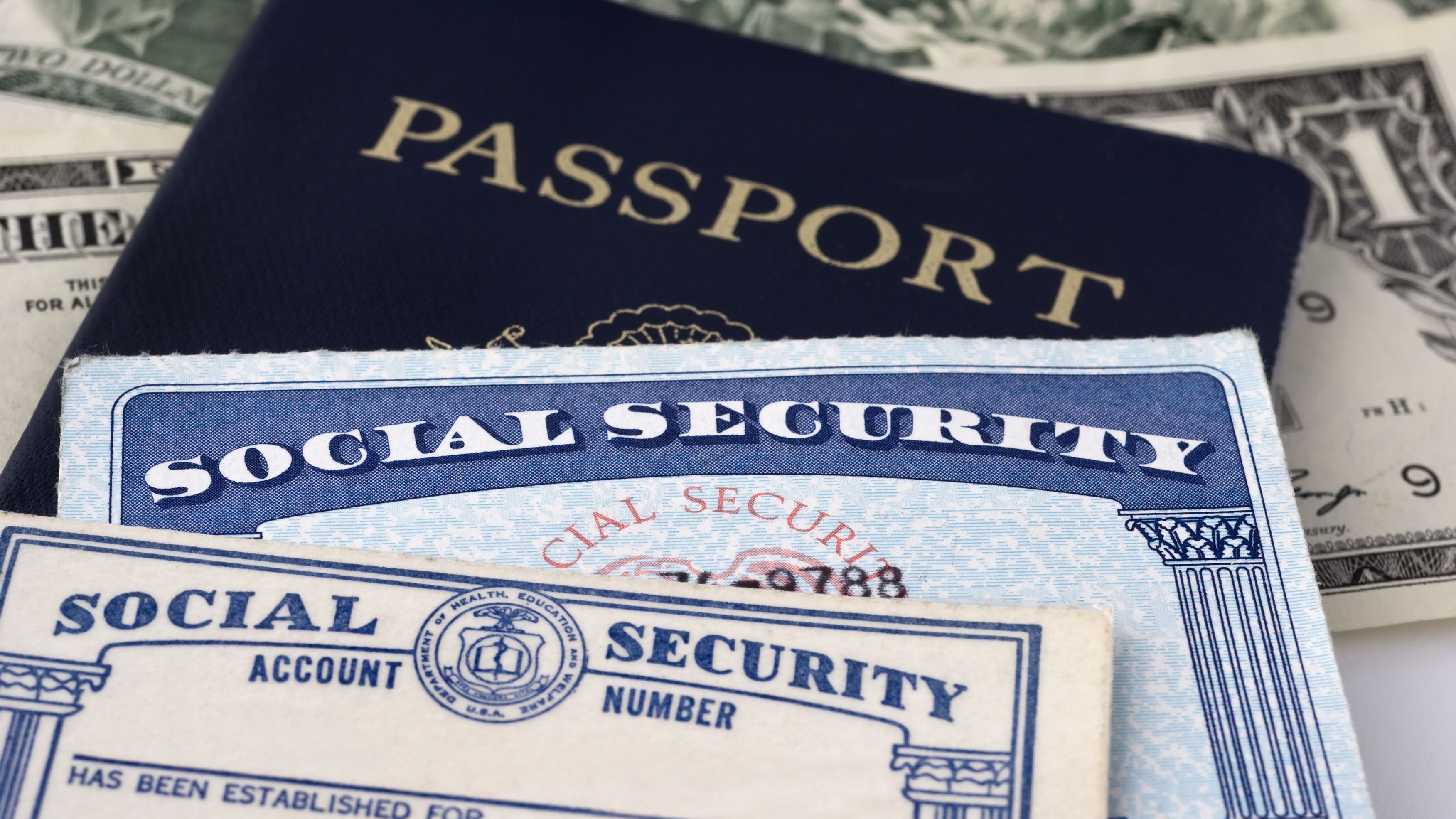 Close up photograph of social security cards & passport, selective focus