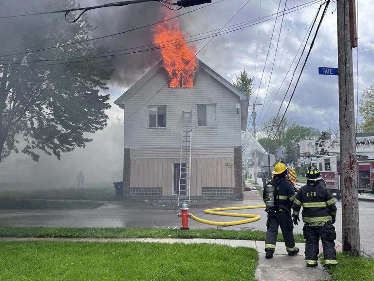 Firefighter injured, dog rescued from Cleveland house fire