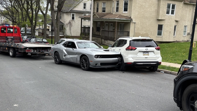 Two men in custody, a third on the run, and a police officer is under ...