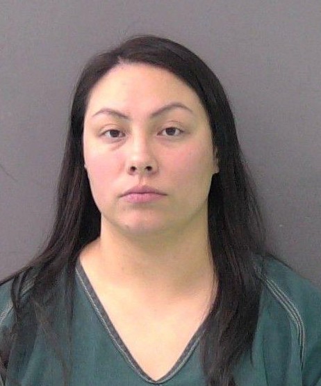 Woman accused of leaving child alone in car while drinking