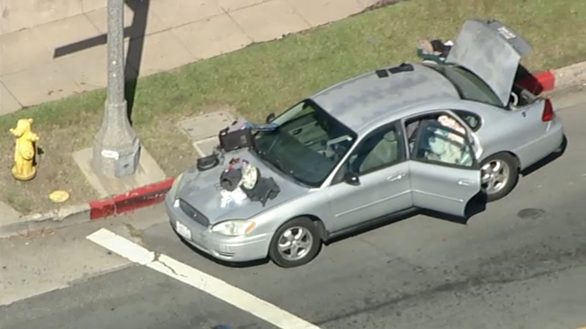 Driver flees traffic stop after man with gunshot wound found in trunk ...