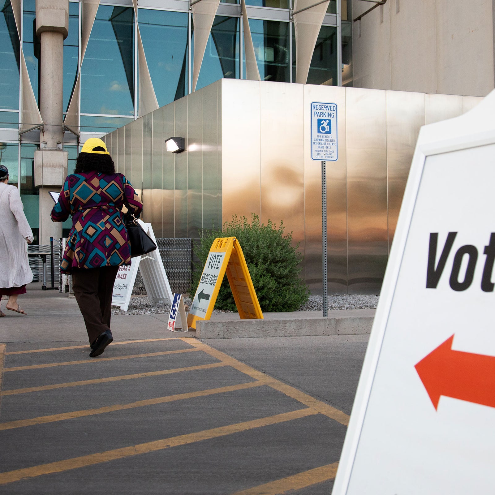 PHOENIX, AZ - NOVEMBER 03: Voters enter Burton Barr Central Library to cast their ballots on November 3, 2020 in Phoenix, Arizona. After a record-breaking early voting turnout, Americans head to the polls on the last day to cast their vote for incumbent U.S. President Donald Trump or Democratic nominee Joe Biden in the 2020 presidential election. (Photo by Courtney Pedroza/Getty Images)