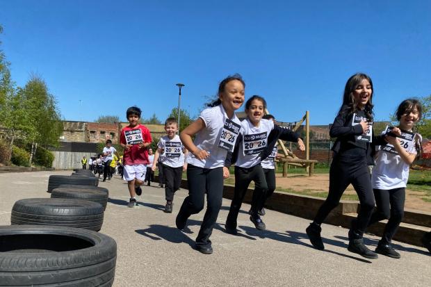 Primary school children swap uniforms for running gear in mini marathon ...
