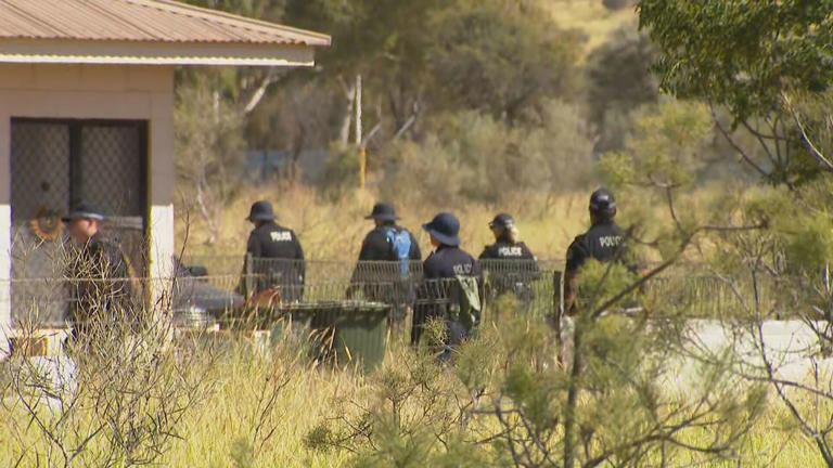 Police scour the house where Sharon Granites was staying in Old Timers camp just outside of Alice Springs when she was allegedly abducted by Jefferson Lewis.