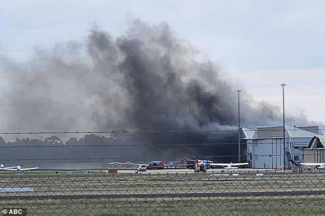 Emergency as small plane crashes into an airport as hangar bursts into ...