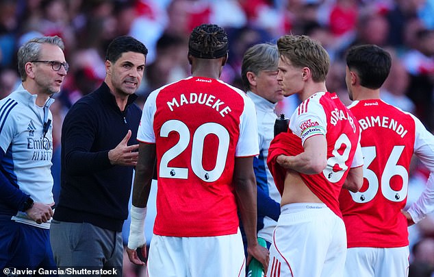 Mikel Arteta (second left) is trying to end Arsenal's 22-year wait for a Premier League title