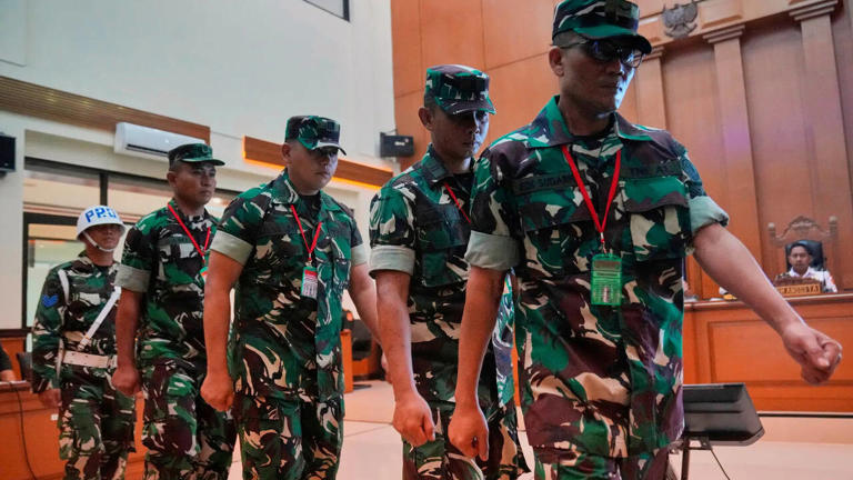 Trial opens for four Indonesian military members charged in acid attack ...