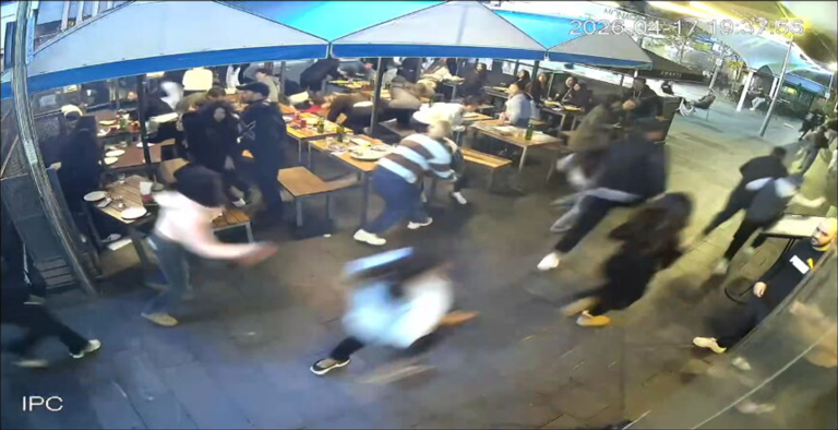One CCTV shows patrons at surrounding tables either fleeing in fear after the attack began, or hiding underneath tables.