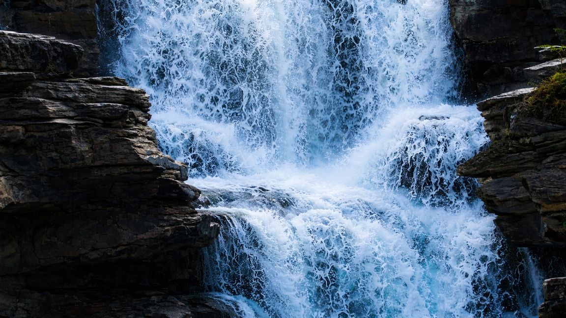 Natural waterfall scene with strong flow and rock details