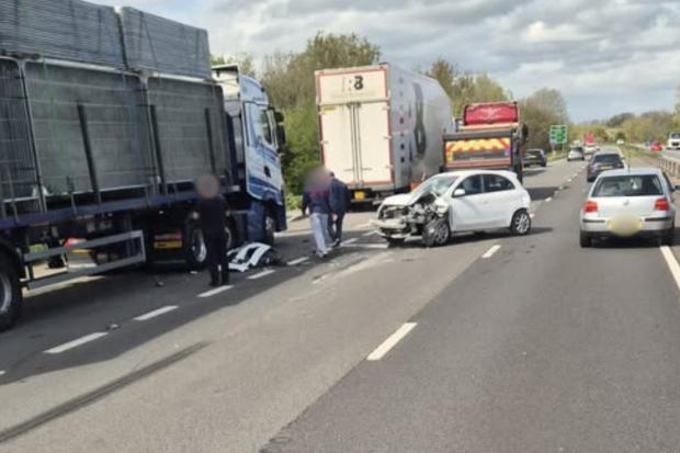 Driver rushed to hospital after lorry and car are mangled in crash