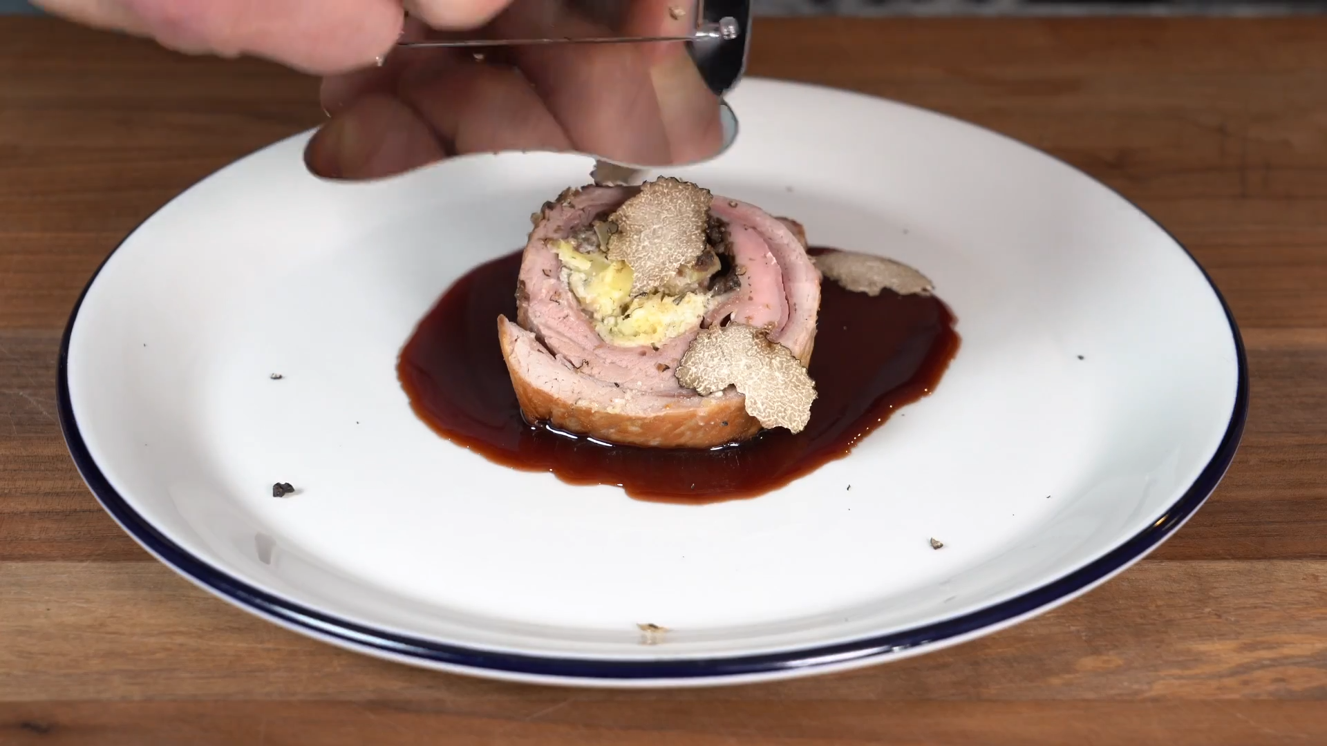 Truffle-stuffed pork tenderloin with port sauce