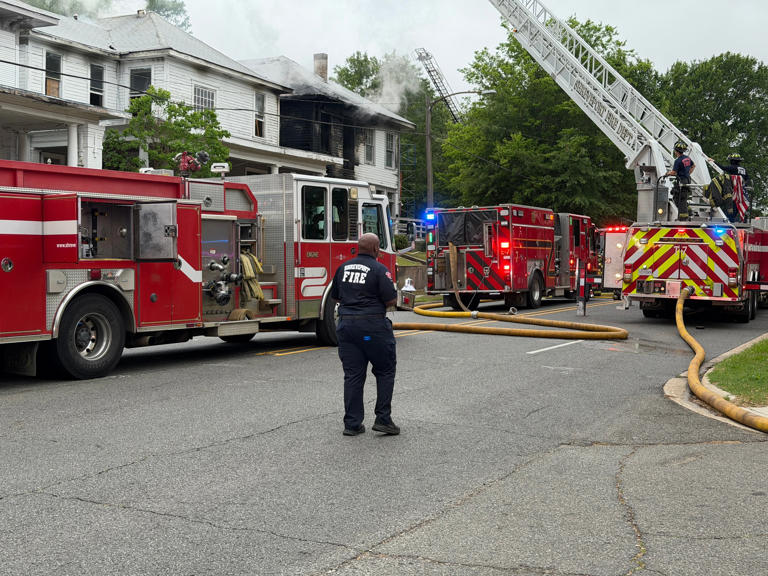 Two firefighters hurt, 65 crew members battle two-story house fire now ...