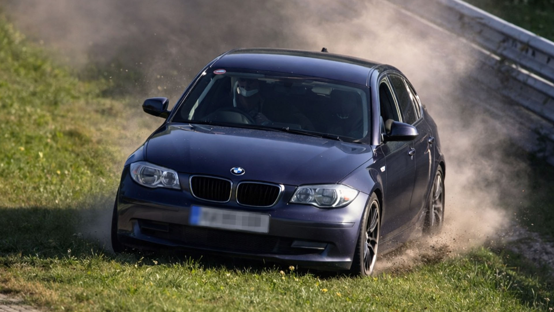 Wide exit sends driver onto grass but control is maintained