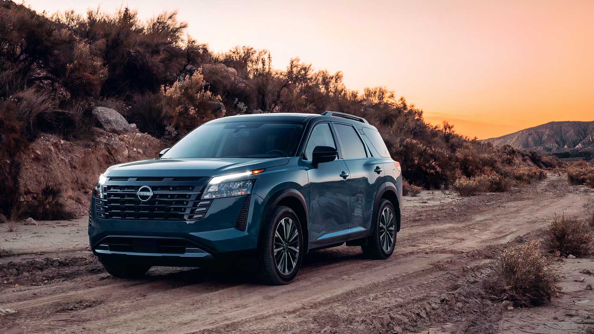 Blue 2026 Nissan Pathfinder Driving Down a Trail