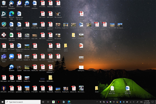 Windows desktop showing many unorganized icons